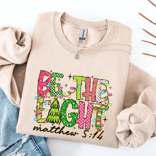Be The Light Christmas Sweatshirt, Religious Christmas Shirt, Christmas Shirt for Women, Christmas Gift, Bible Verse Sweatshirt