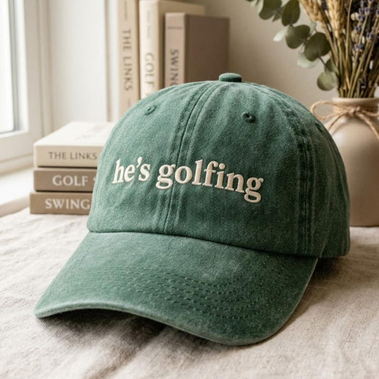 Embroidered He's Golfing Hat, Golf Dad Cap, Golfer Wife Gift
